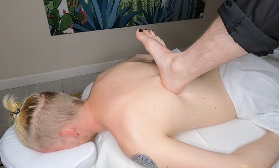 Sole Symphony Ashiatsu barefoot massage therapist applying foot pressure at Awaken Zen Spa in Mesa, AZ